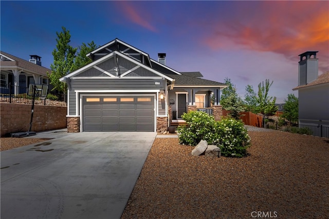 craftsman-style home featuring a porch and a garage