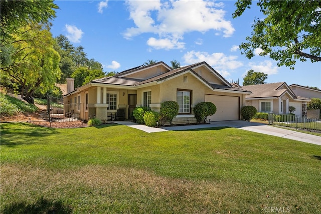 view of front of house featuring a garage and a front lawn