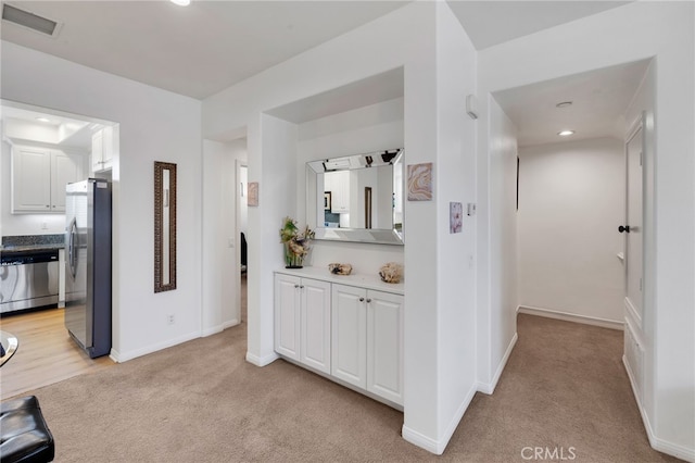 hallway with light carpet