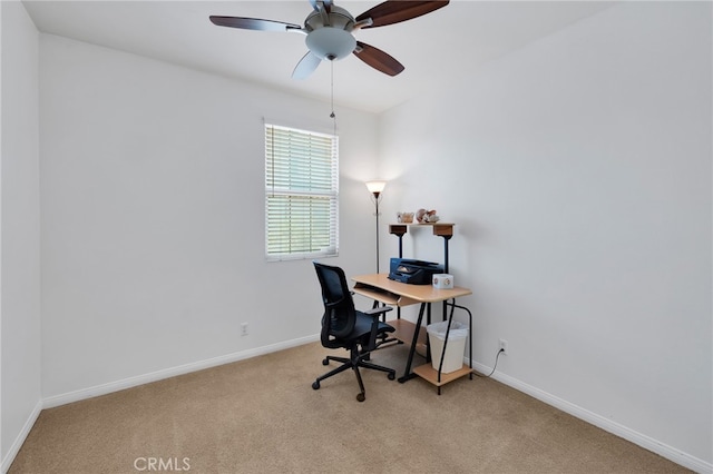 office space with light carpet and ceiling fan