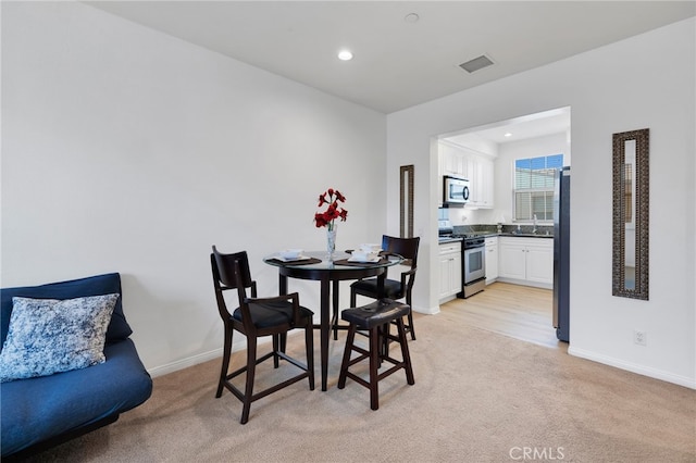 view of carpeted dining room