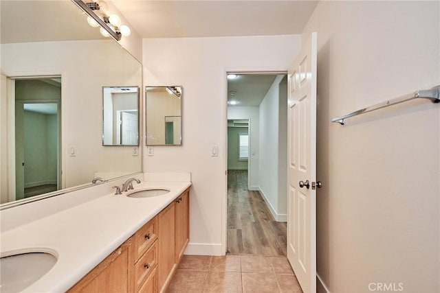 bathroom featuring hardwood / wood-style floors and vanity