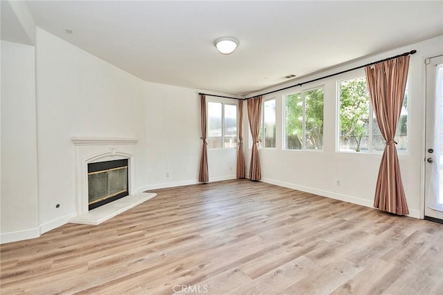 unfurnished living room with light wood-type flooring