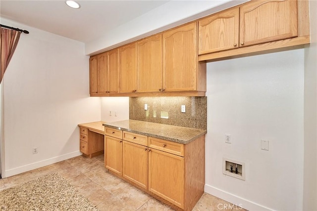 kitchen with decorative backsplash, light stone counters, light brown cabinetry, and light tile patterned flooring