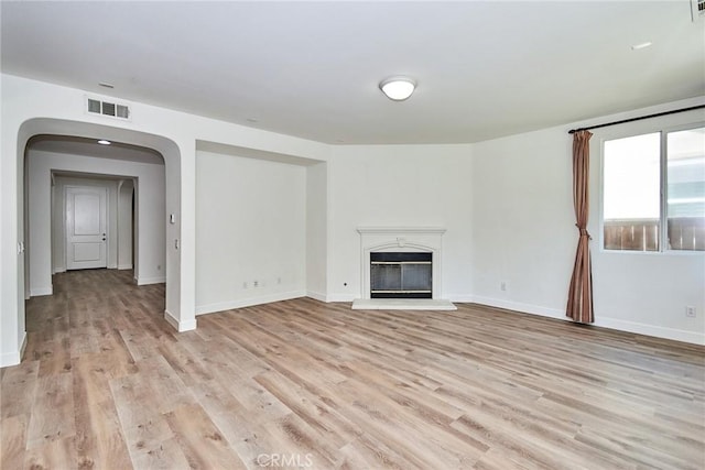 unfurnished living room featuring light hardwood / wood-style floors