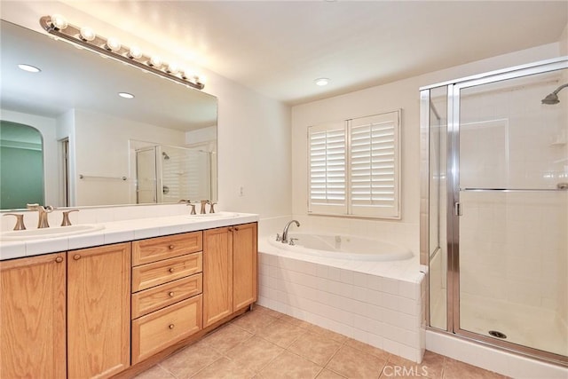 bathroom featuring tile patterned flooring, vanity, and independent shower and bath