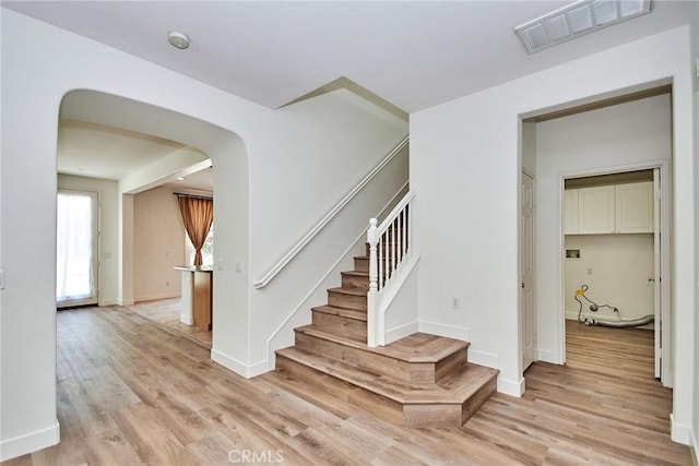 stairway featuring hardwood / wood-style floors