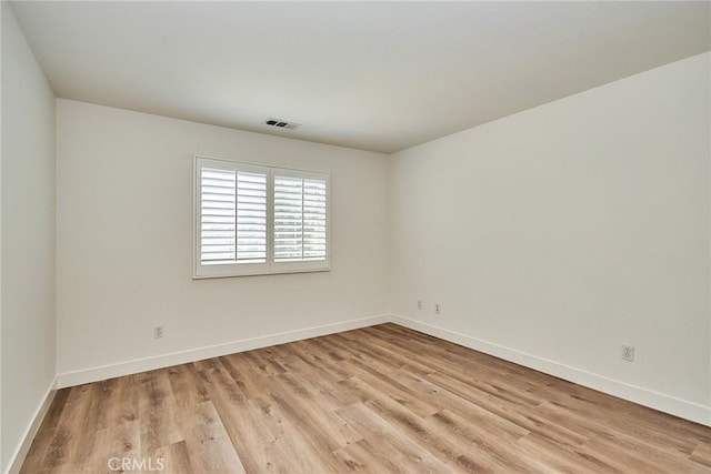 unfurnished room featuring light hardwood / wood-style flooring