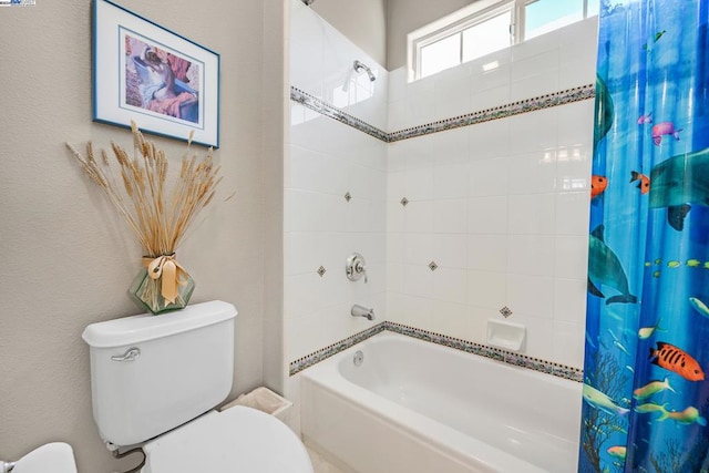 bathroom with shower / bath combo and toilet