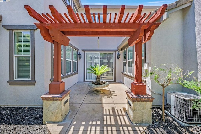 view of patio with a pergola and central AC