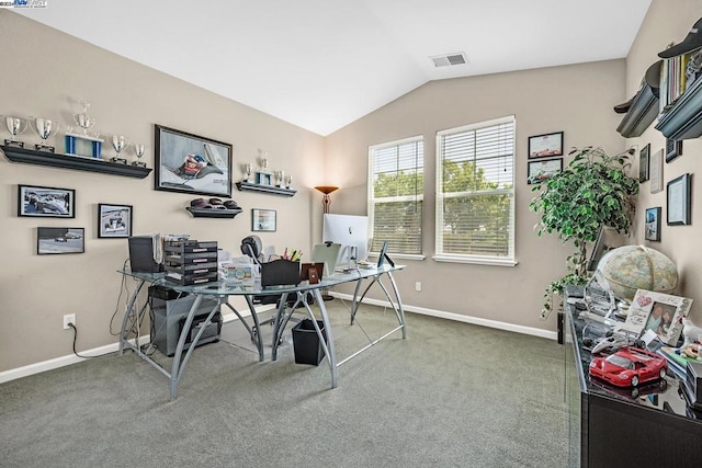 carpeted office featuring vaulted ceiling