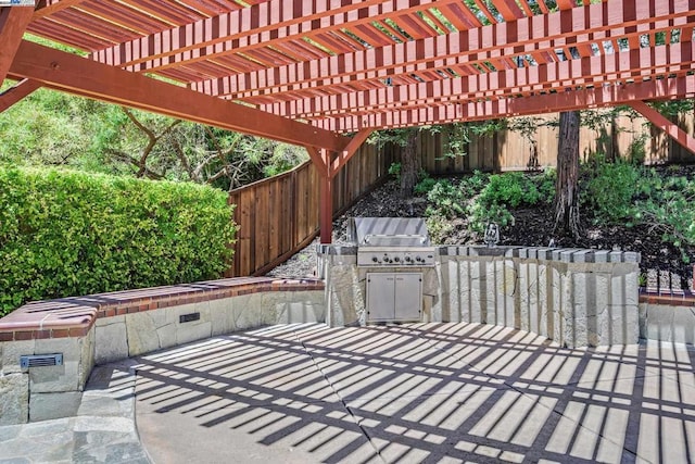 view of patio with a pergola, area for grilling, and grilling area