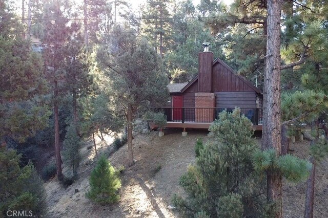 rear view of property with a deck