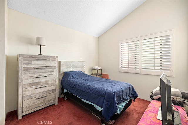 carpeted bedroom with vaulted ceiling