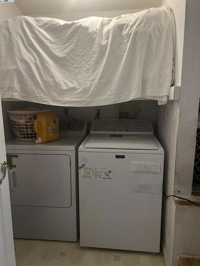 laundry area featuring independent washer and dryer