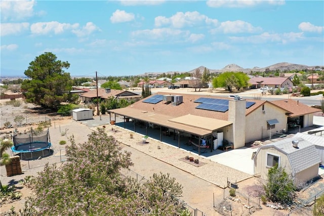 drone / aerial view with a residential view and a mountain view