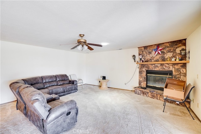 living room featuring carpet, ceiling fan, a fireplace, and visible vents