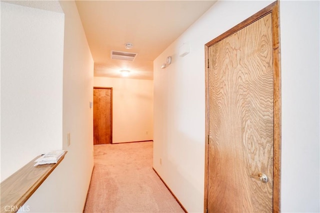 corridor featuring visible vents and carpet