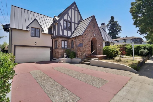 tudor home featuring a garage