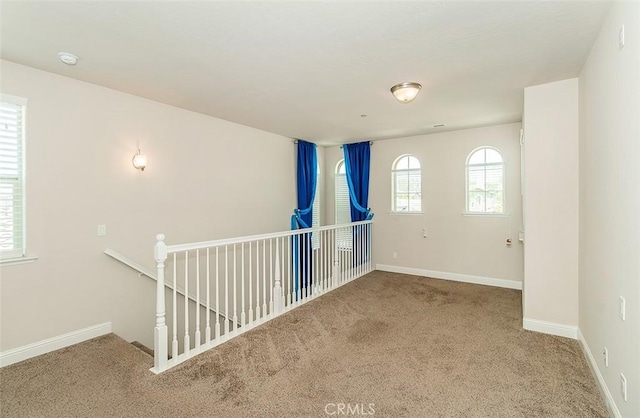 spare room with carpet floors