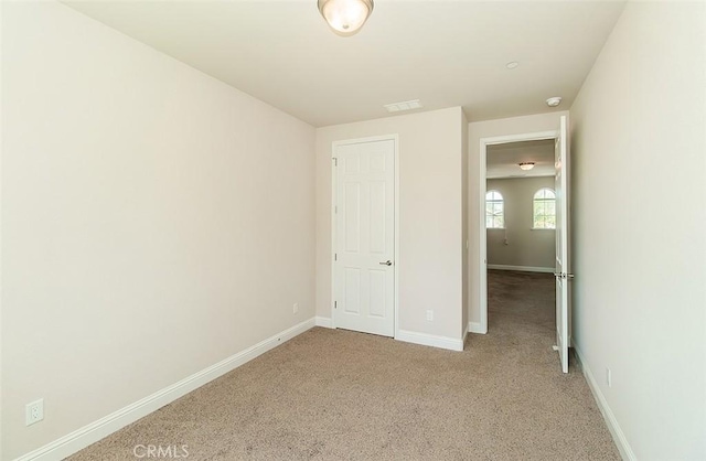 unfurnished bedroom featuring carpet flooring