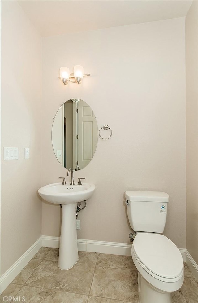 bathroom with sink and toilet