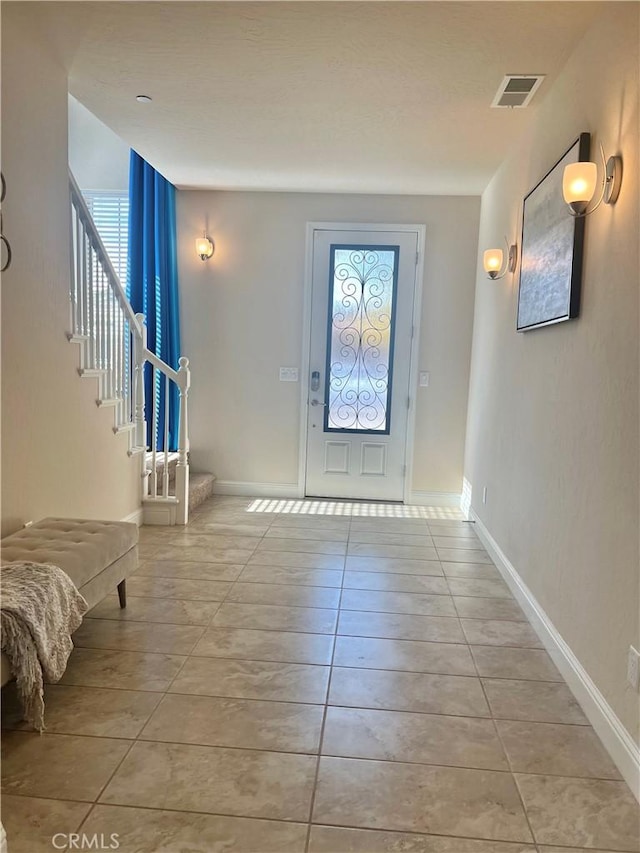 foyer entrance featuring light tile patterned floors