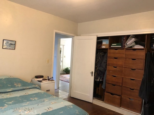 bedroom featuring dark wood-type flooring