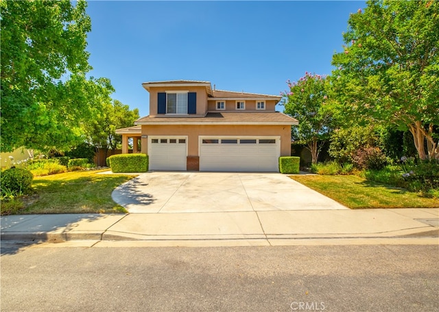 view of front of house with a front lawn and a garage