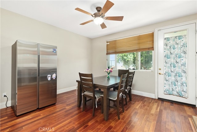 dining room featuring ceiling fan and dark hardwood / wood-style flooring