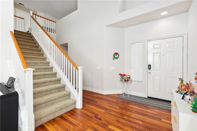 entryway with hardwood / wood-style flooring