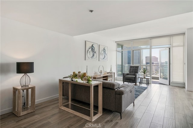 living room with hardwood / wood-style floors and expansive windows