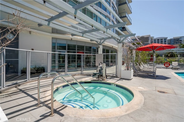 view of pool featuring a patio area and a community hot tub