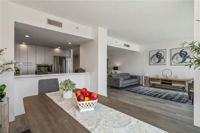 dining room with hardwood / wood-style flooring