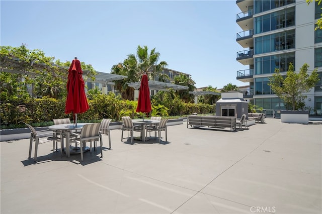 view of patio / terrace with a balcony