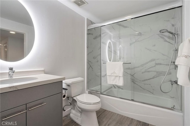 400 W Ocean Blvd Unit 1601, Long Beach, CA 90802 - full bathroom with vanity, combined bath / shower with glass door, toilet, and wood finished floors