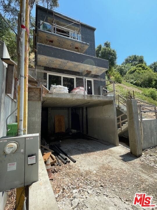 view of home's exterior with a balcony