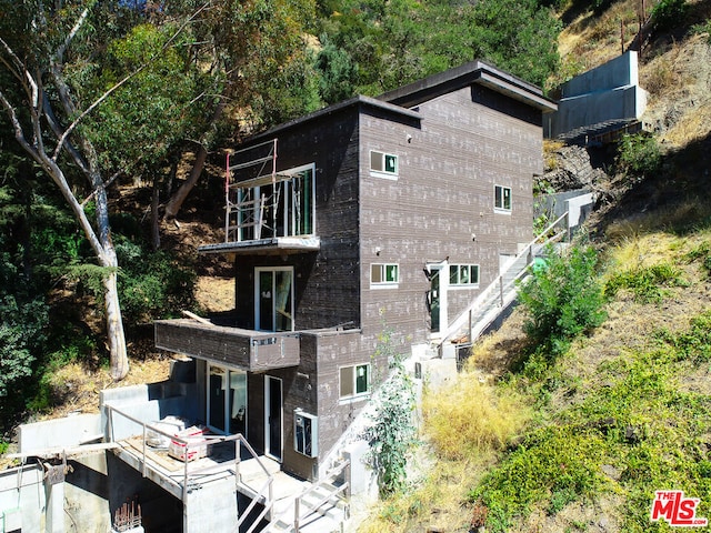 exterior space with a patio and a balcony