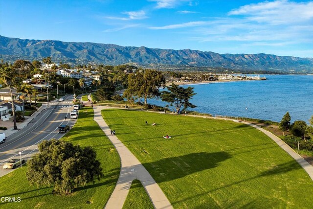 aerial view featuring a water and mountain view