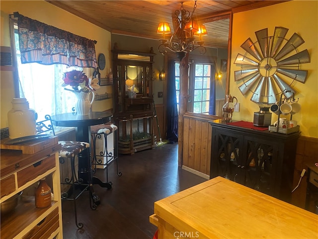 interior space featuring wood walls, dark wood-type flooring, a chandelier, and wooden ceiling