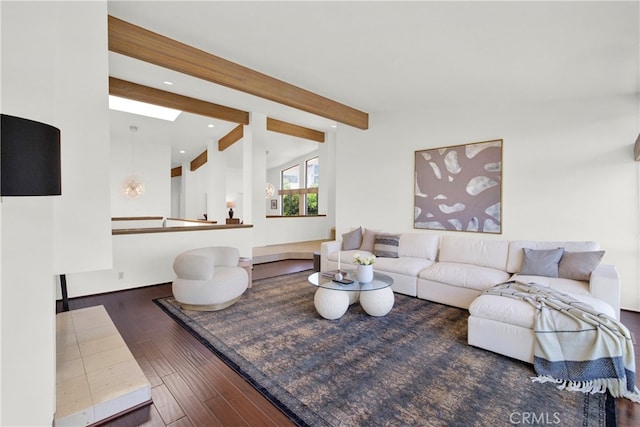 living room with dark hardwood / wood-style floors and beam ceiling