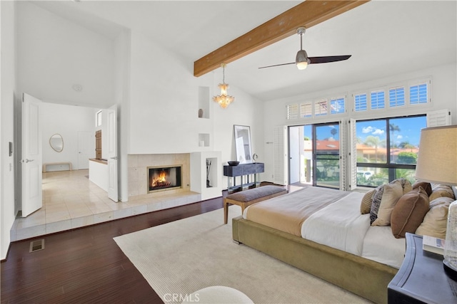 32701 Via Palacio, Rancho Palos Verdes, CA 90275 - bedroom featuring high vaulted ceiling, wood finished floors, a tiled fireplace, beamed ceiling, and access to outside