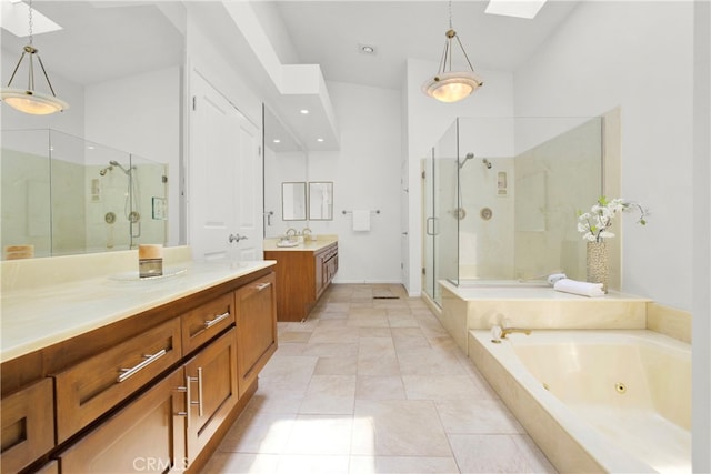 bathroom with vanity, high vaulted ceiling, plus walk in shower, tile patterned floors, and a skylight