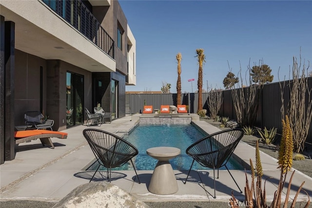 view of swimming pool featuring a patio