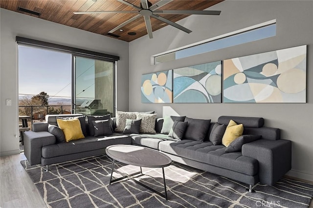 living room with ceiling fan, hardwood / wood-style floors, and wood ceiling