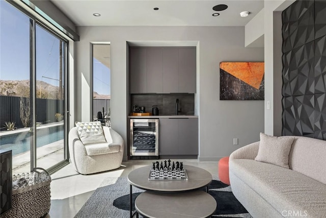 living room with sink and beverage cooler