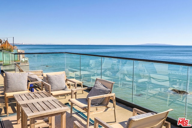 balcony featuring a water view