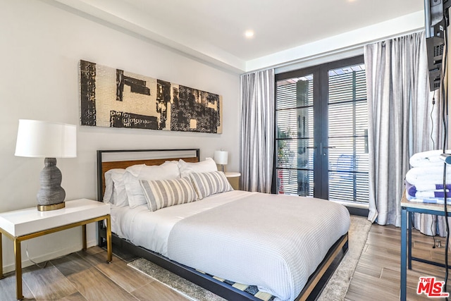 bedroom featuring hardwood / wood-style floors