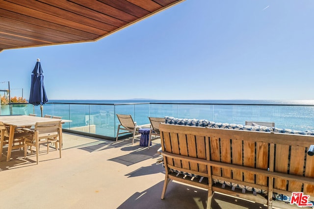 balcony featuring a water view