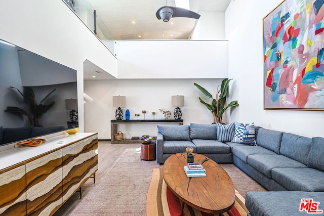 living room with a high ceiling